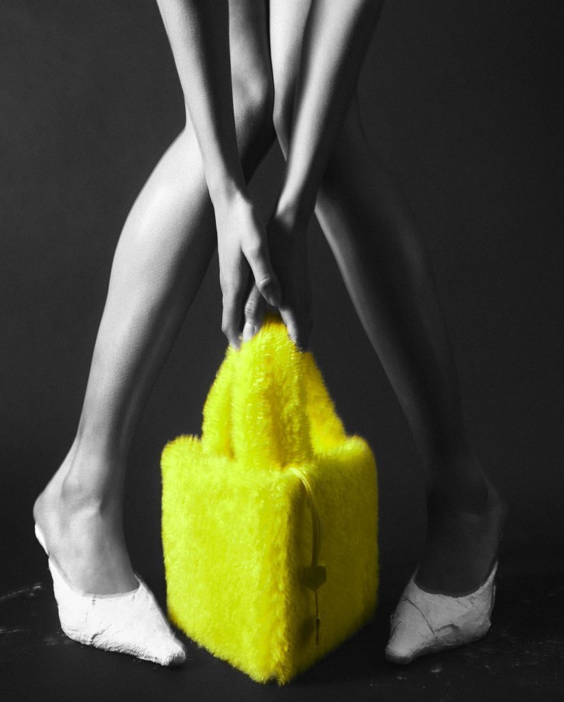 Talel-paris-black-and-white-photo-legs-models-yellow-bag