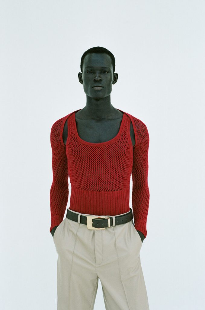 dark-skinned-man-red-top-fashion-situationist-photoshoot-lookbook