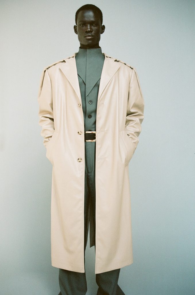 man-green-uniform-fashion-situationist-trench-coat-trendy-classic-quiet-luxury