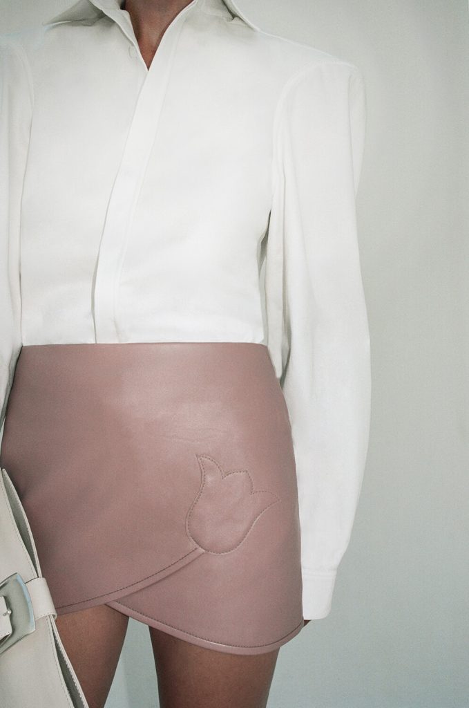 candid-photo-pink-leather-skirt-white-blouse-situationist