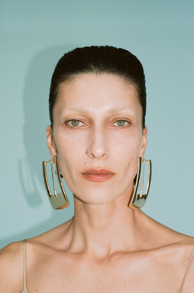 woman-eclectic-earrings-slicked-back-hair-professional-photoshoot